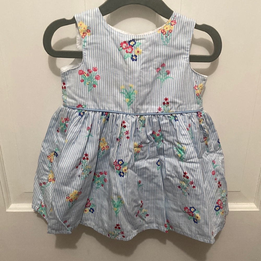 Primark baby girl 6-9 month dress. Blue and white striped with flowers. Lined